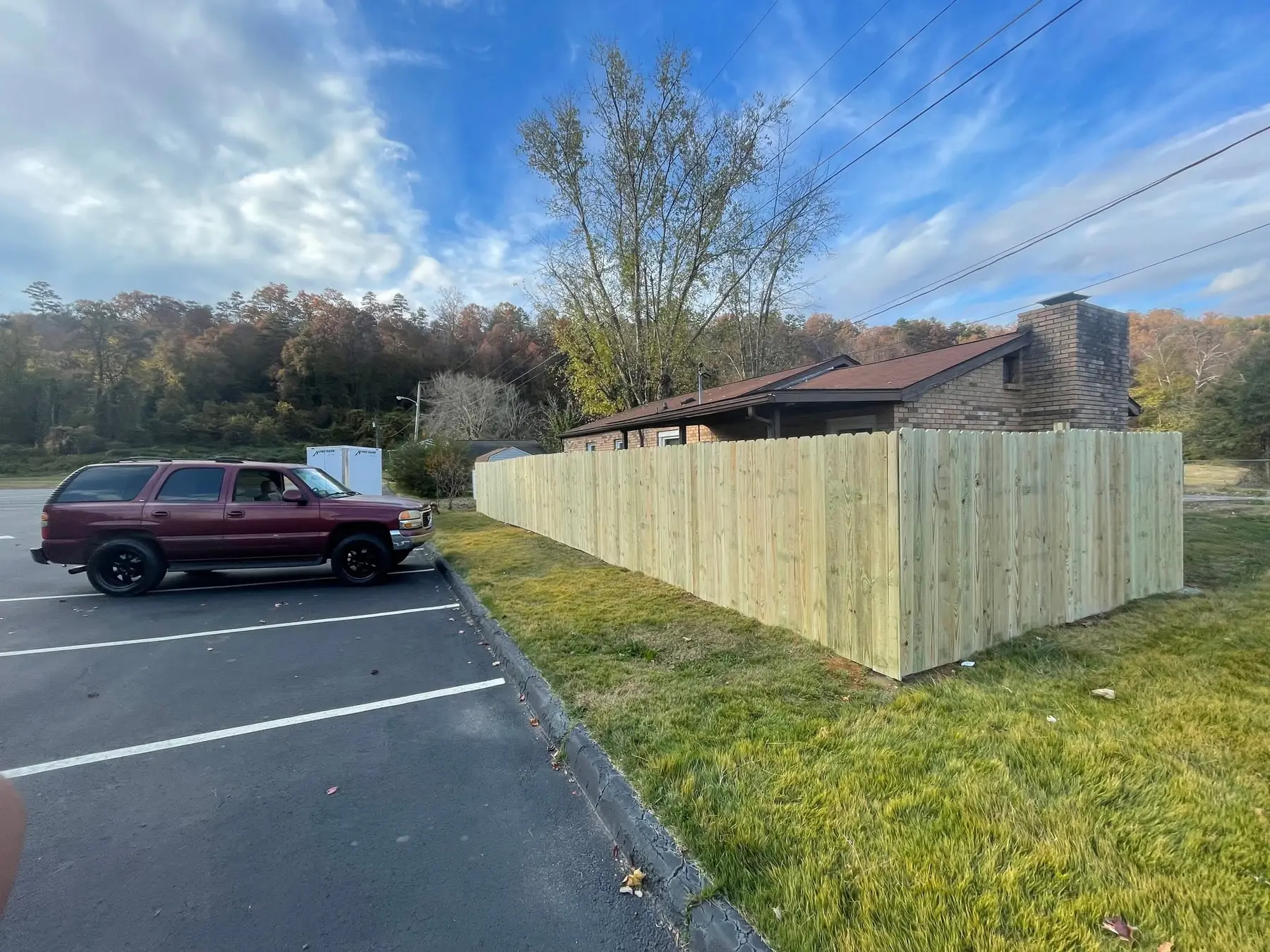 Completed wood privacy fence enclosing the outdoor area
