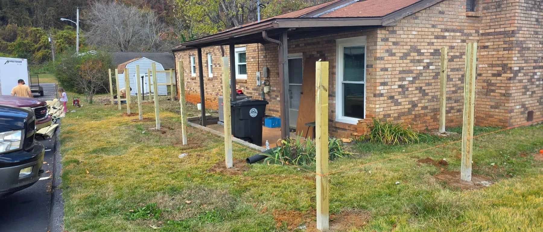Privacy fence posts aligned around the residential property